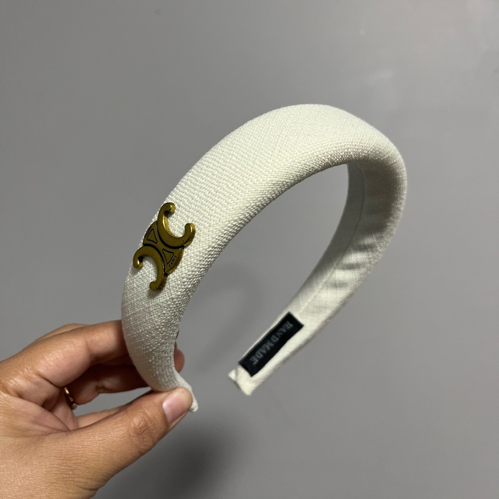 Elegant White Headband with Gold Accent